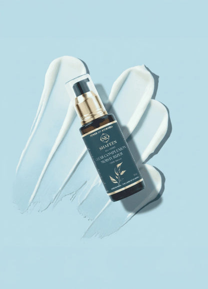 Skincare serum bottle with dropper on a light blue background